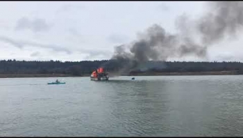 Kayaker Rescues Fisherman from Burning Boat
